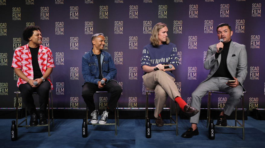 panelists on stage at film festival